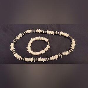 Women.. brown and beige necklace with a matching bracelet.